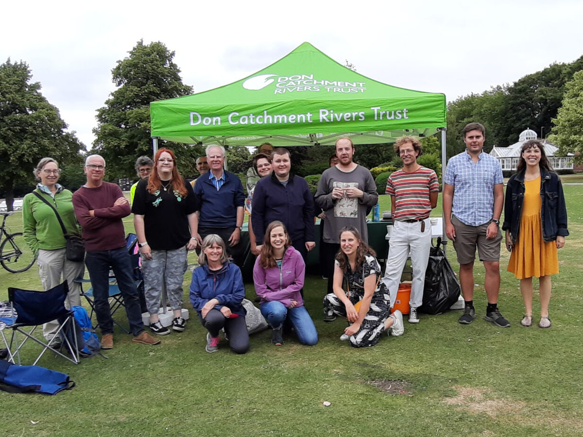 Group of volunteers and staff standing together at a Don Catchment Rivers Trust event beside the River Rother.